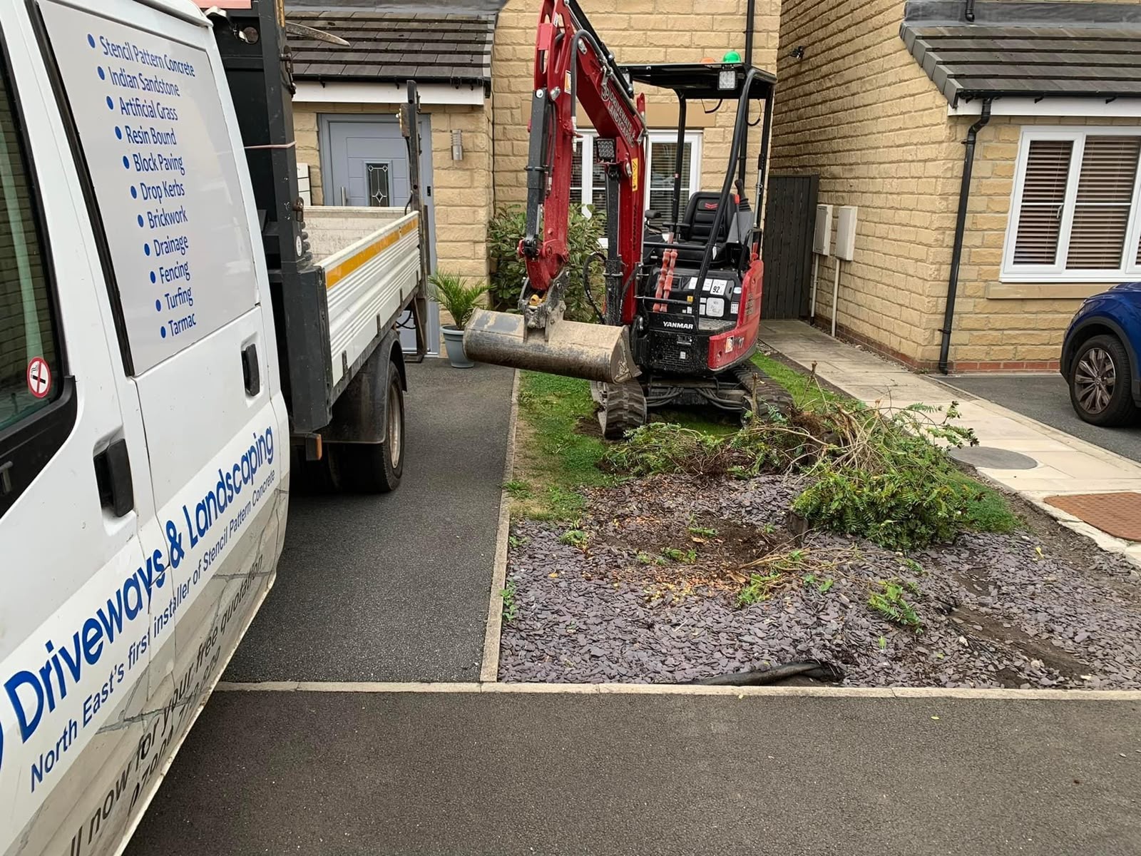 Gravel driveway and decorative stone landscaping by JP Driveways & Landscaping: project 6